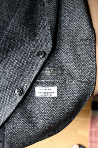Interior close up of the tweed blazer with the labeling visible.