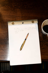 close-up of a notebook and pen