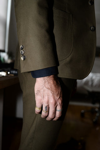 Close-up of Dylan's shirt cuff and suit sleeve.