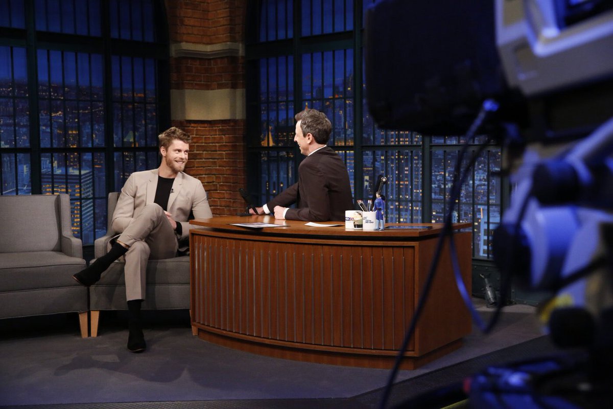 Luke wears a tan BKT35 suit from Brooklyn Tailors on Late Night with Seth Myers.