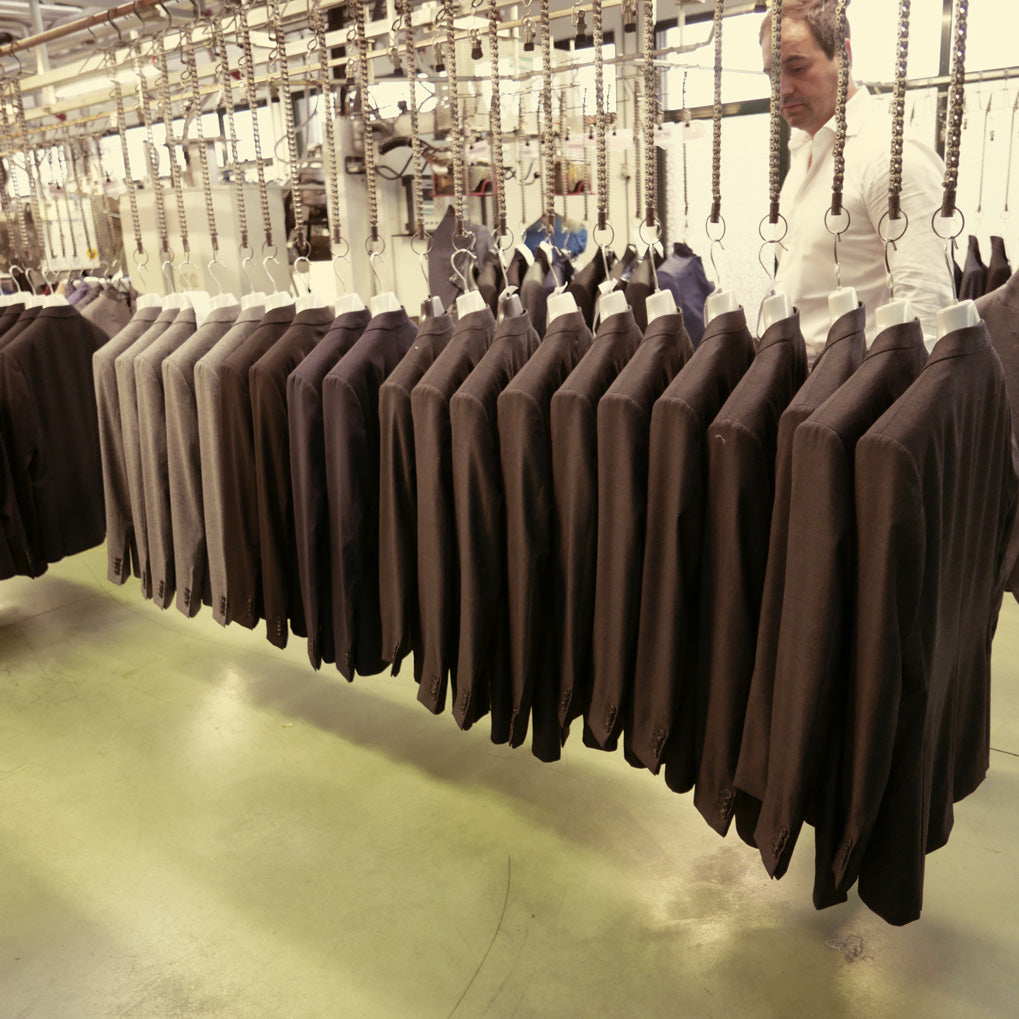 A line of completed jackets waiting to be checked and packaged.