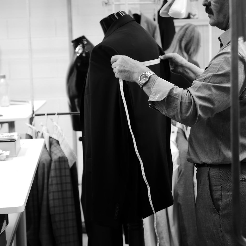 Final measurements being taken of a jacket to ensure jacket was made to spec.