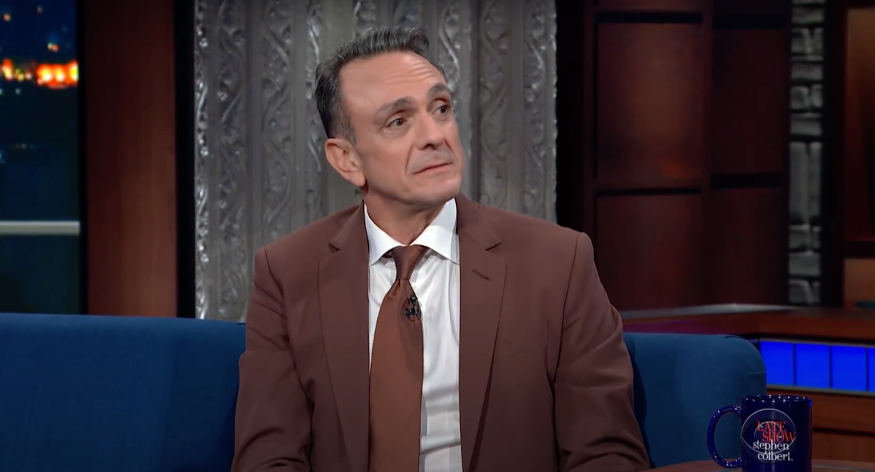 Still shot of Hank Azaria wearing a Brick Herrningbone suit from Brooklyn Tailors on The Late Show with Stephen Colbert
