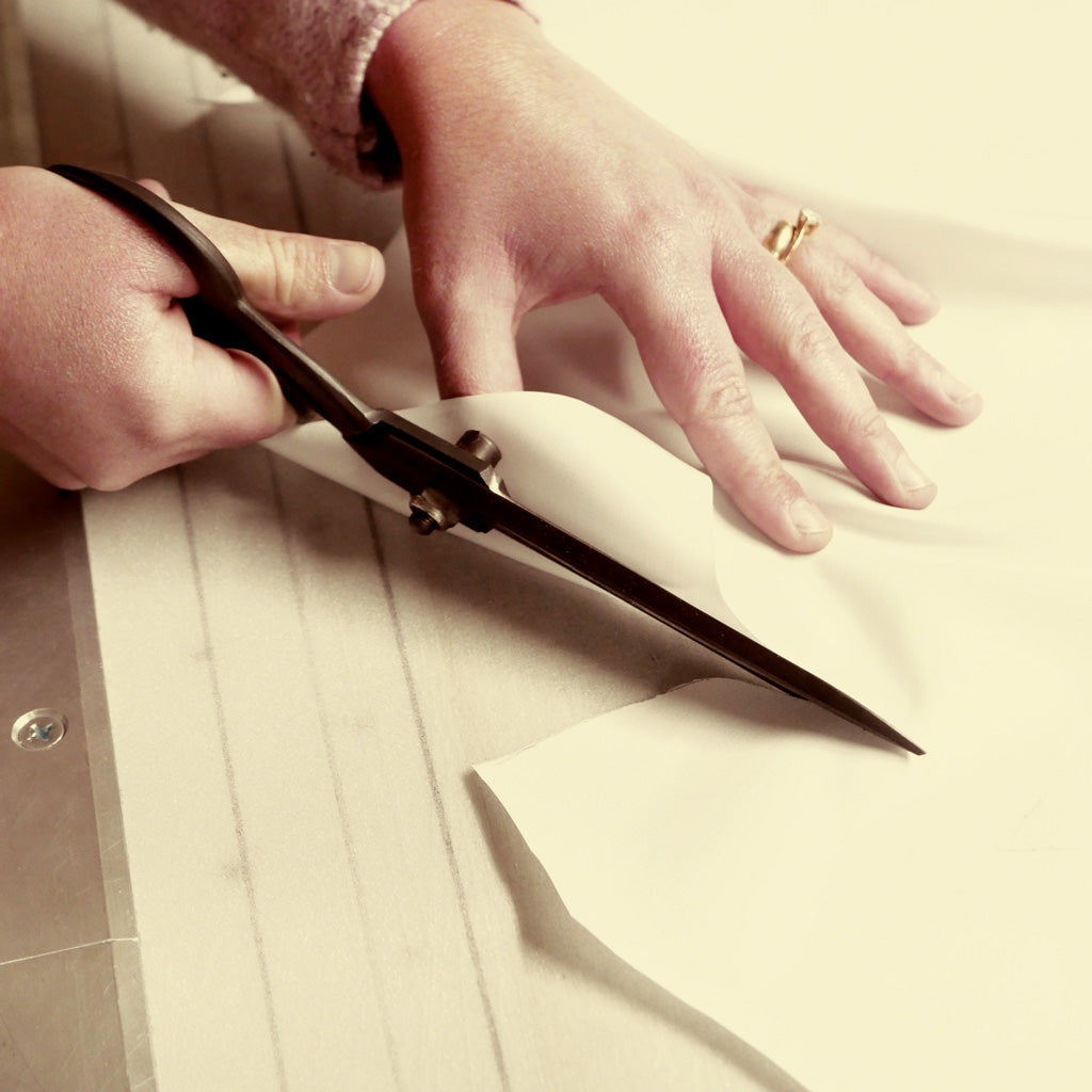 A Bespoke Shirt Being Cut By Hand