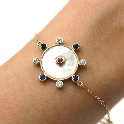 Mother of pearl and gold bracelet with sapphire and rubies