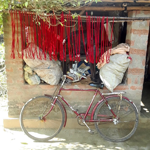 red bicycle, red thread