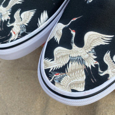 White Cranes on Black Slip-on Vans