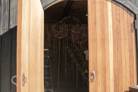 Installation of Lee Display's Hanging Spheres for the Hill Family Winery's newest tasting experience