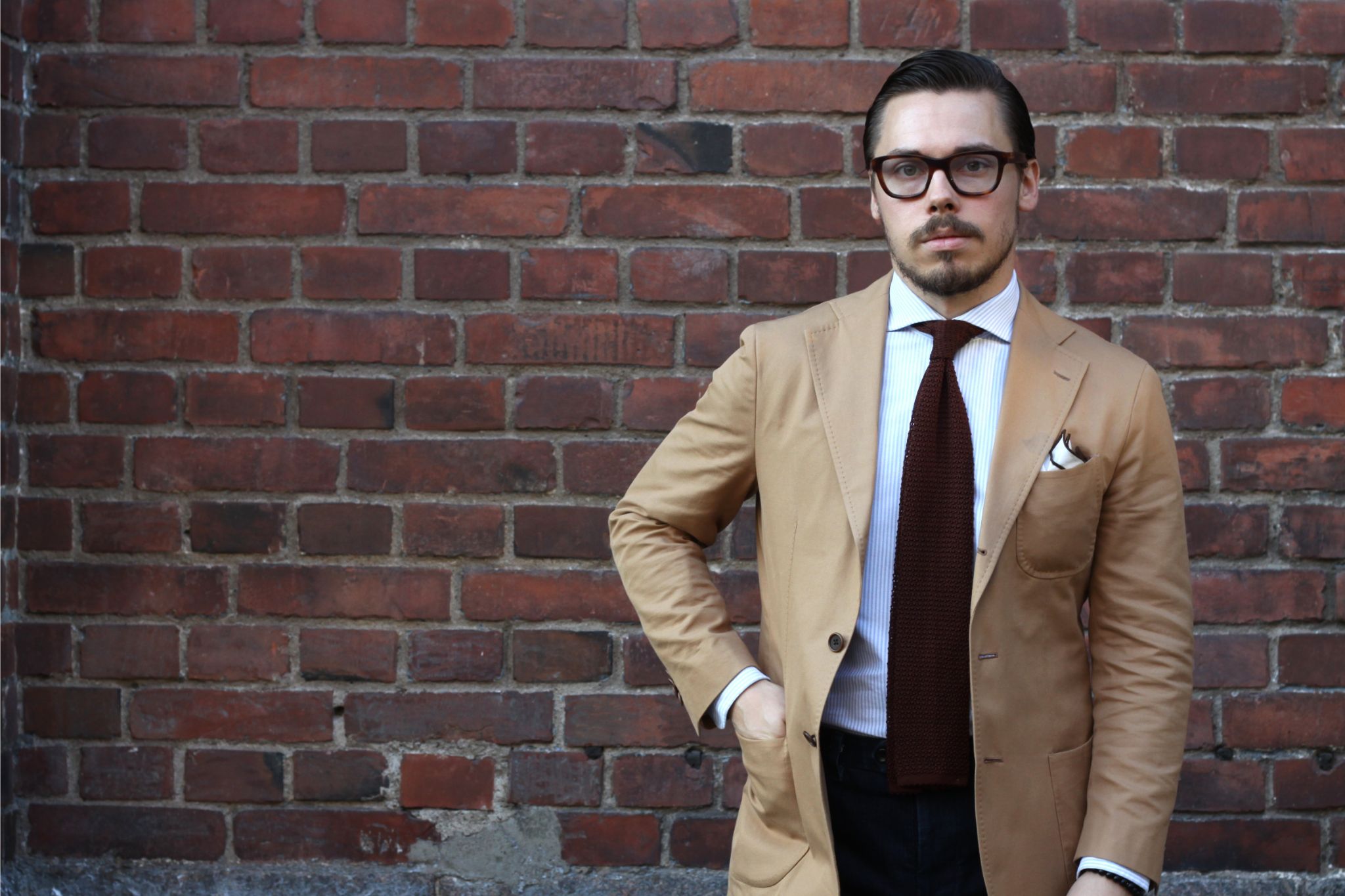 Camel colored cotton suit jacket and a knitted tie