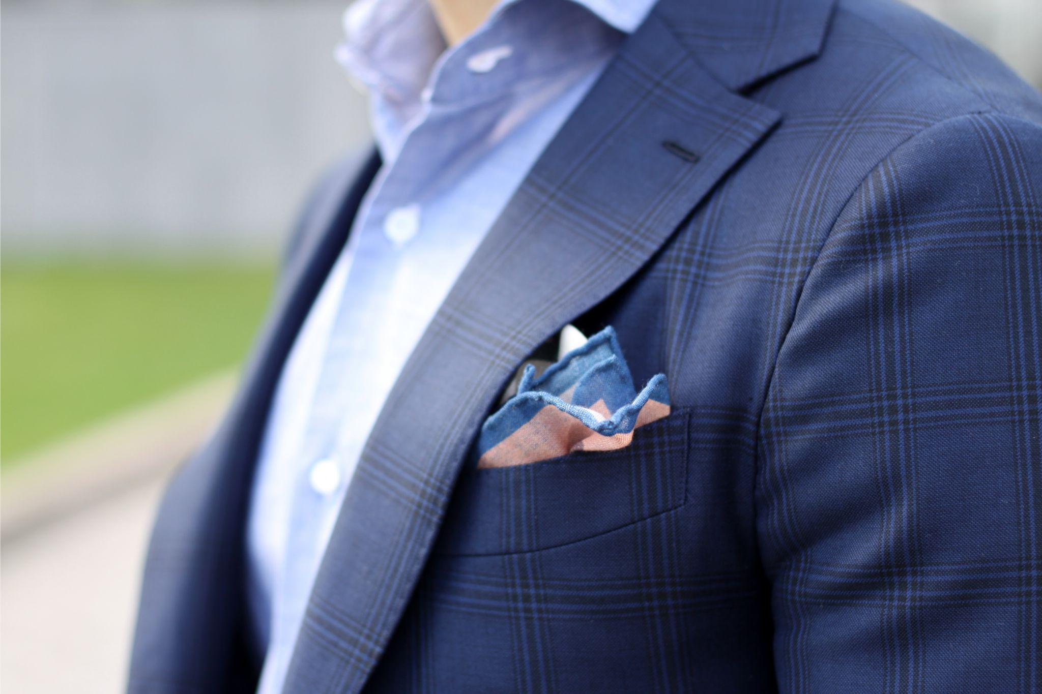 Christian Kimber pocket square with Isaia shirt and blue suit jacket