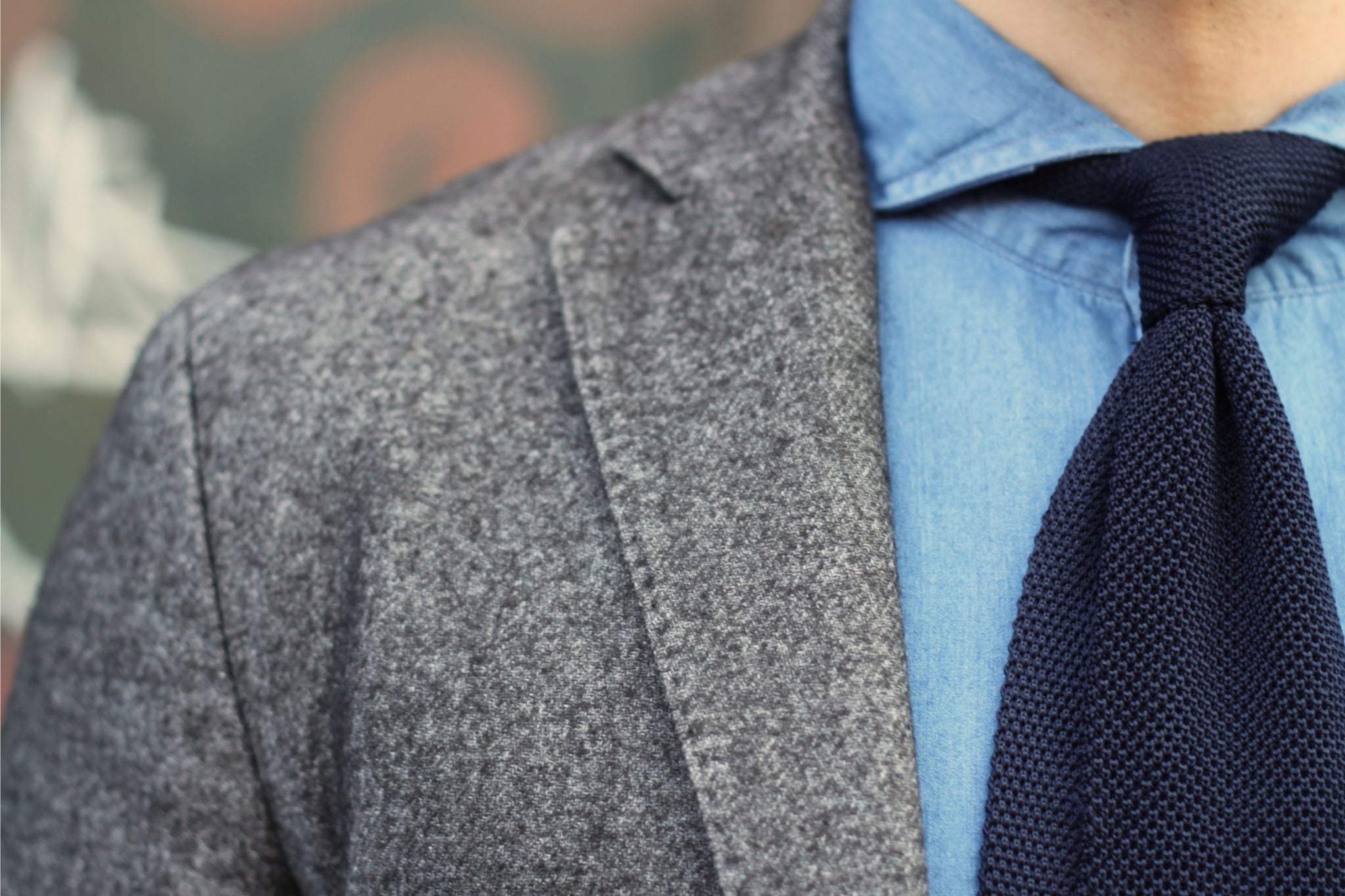 Dark blue knitted tie with brown blazer