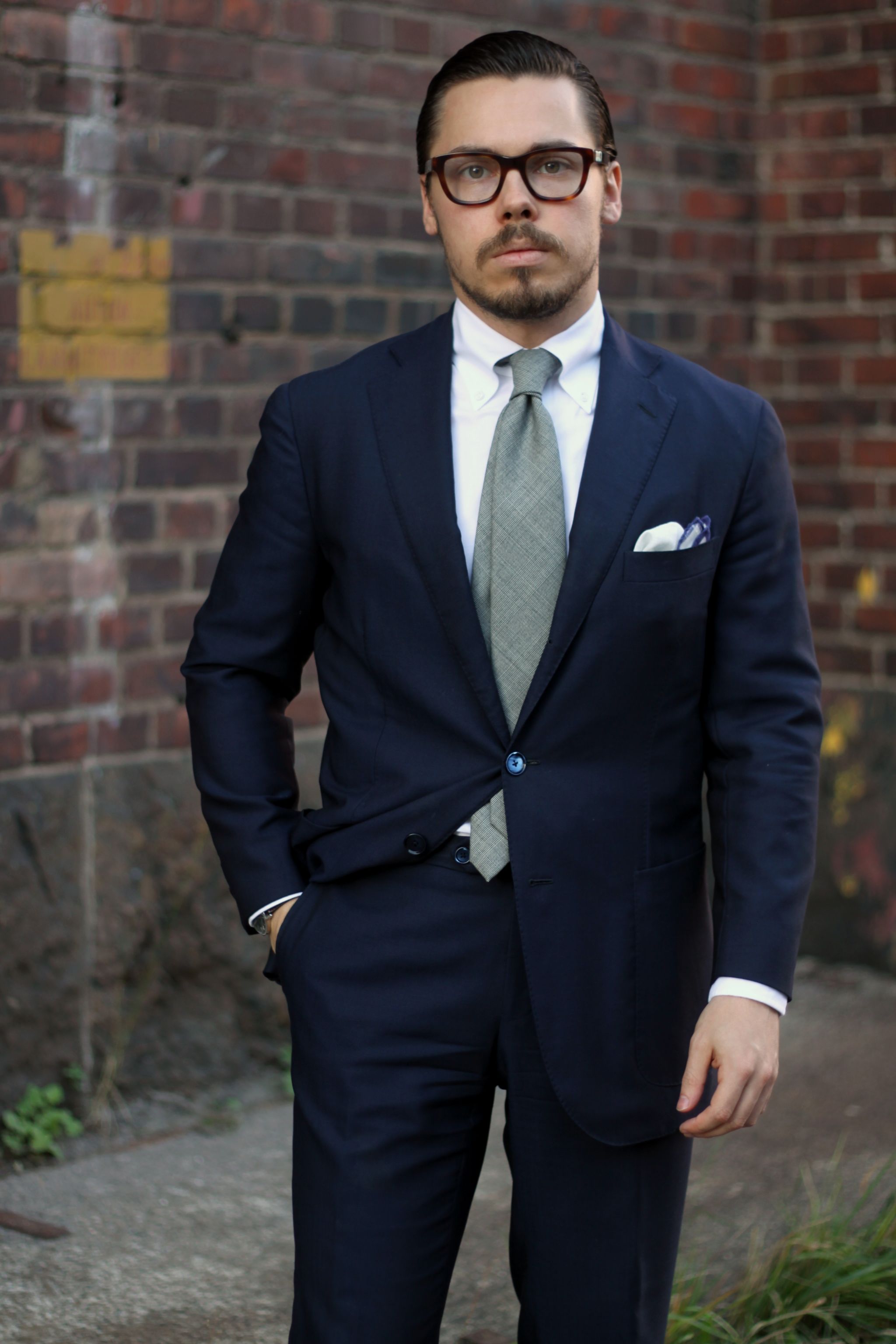 Patch pockets with business suit - dark blue suit with white shirt and gray wool tie