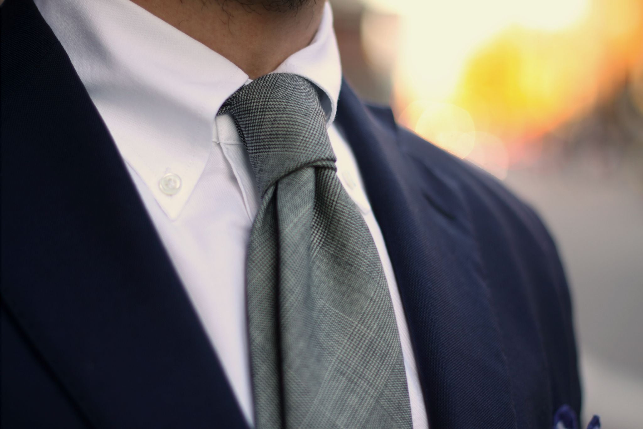 Dark blue suit for business casual - details of gray wool tie with white button down shirt
