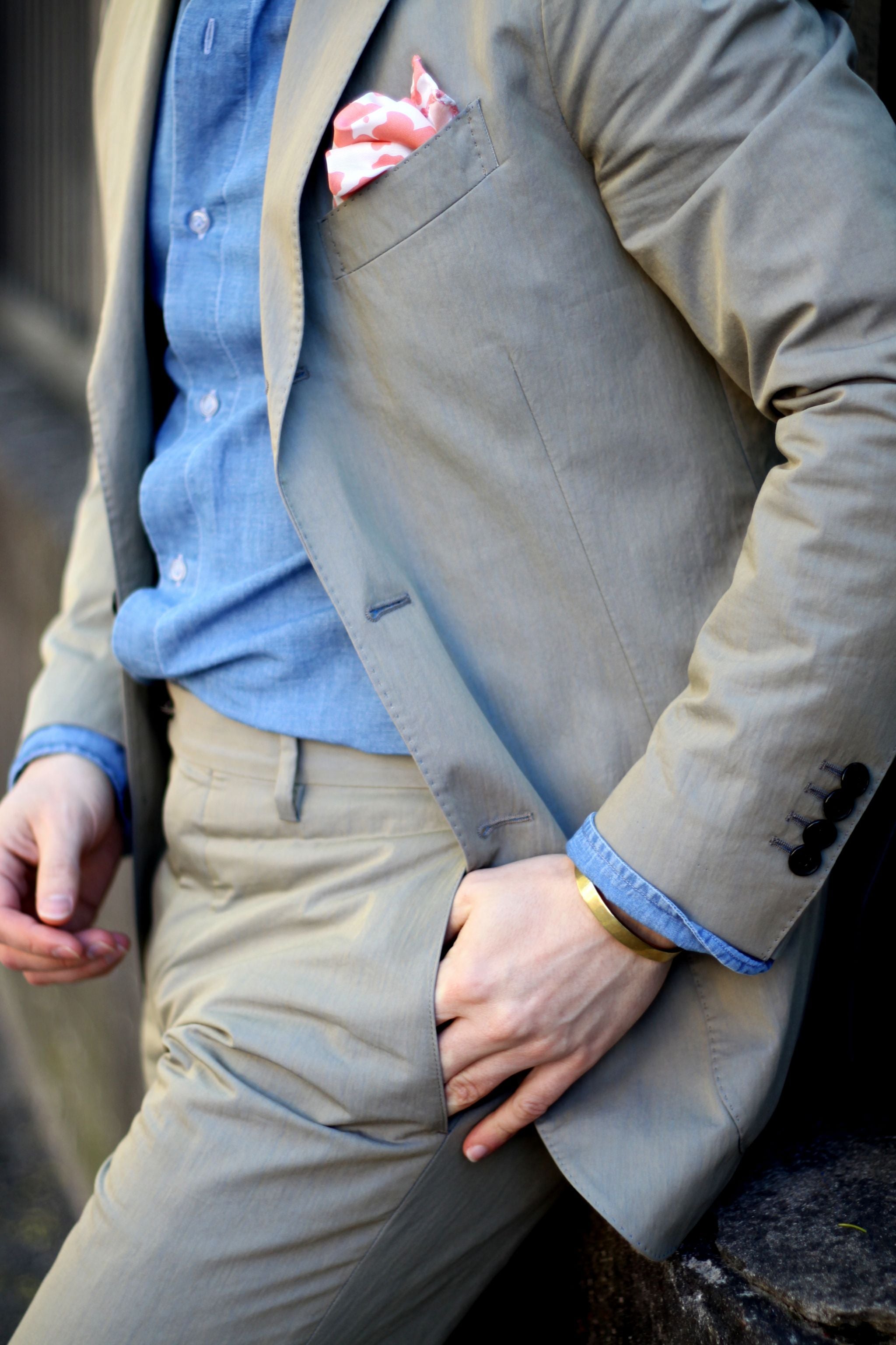 Suit without tie - details of olive green cotton suit and denim shirt