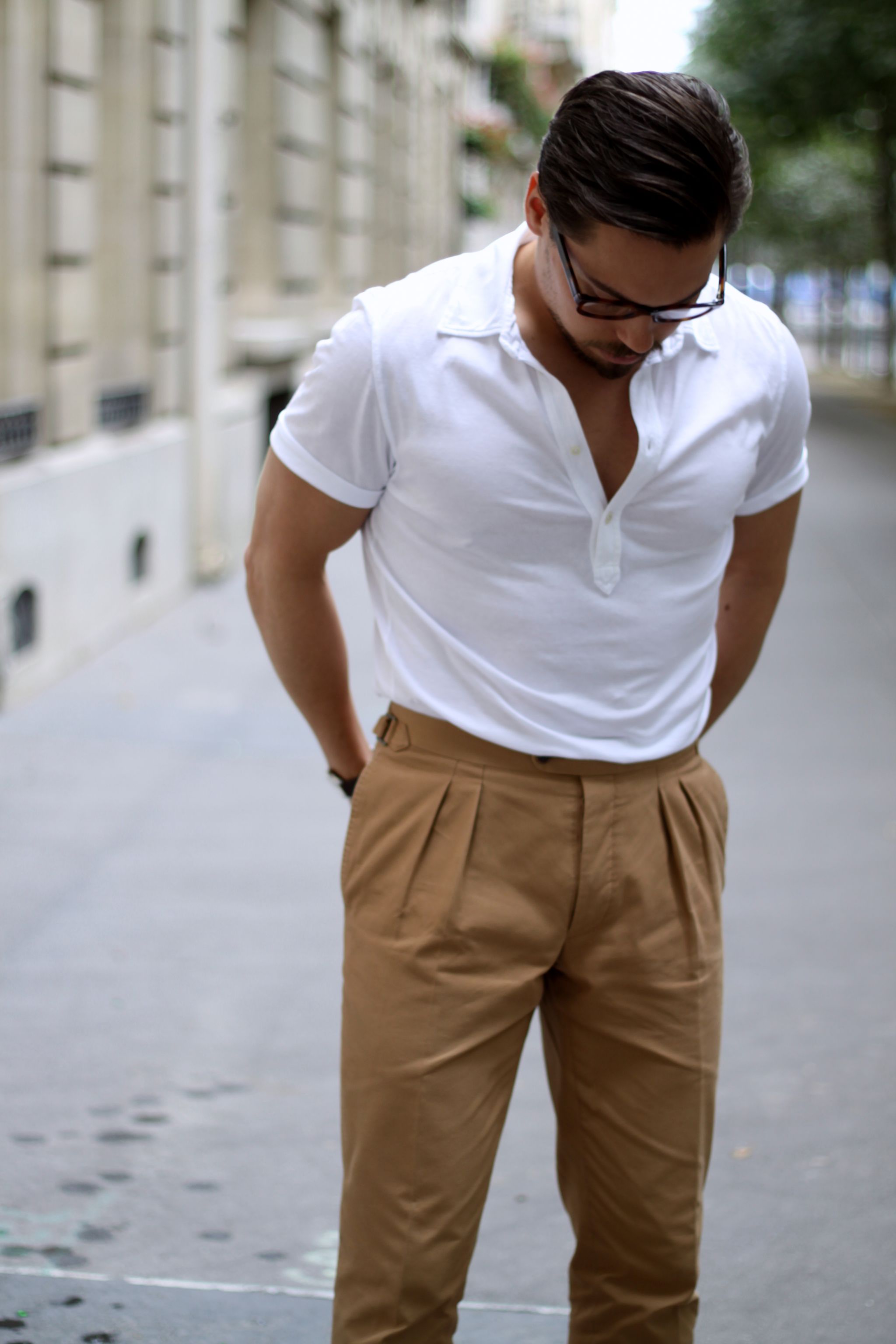 White polo shirt with camel colored cotton trousers