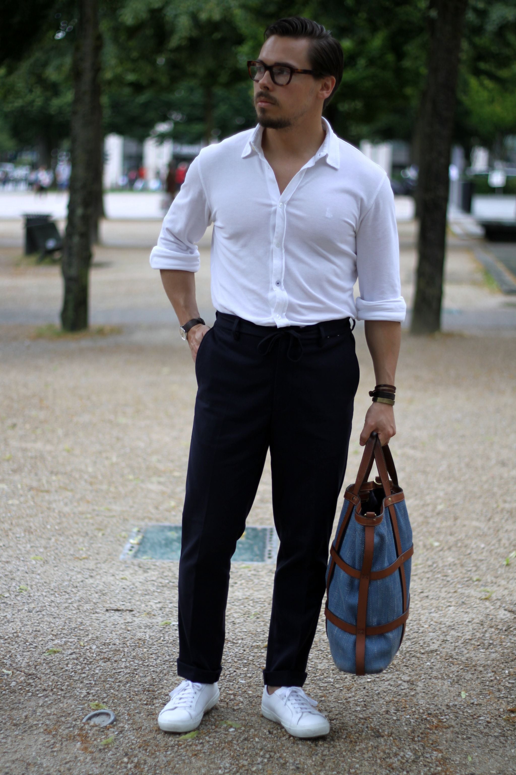 White shirt with blue trousers and sneakers
