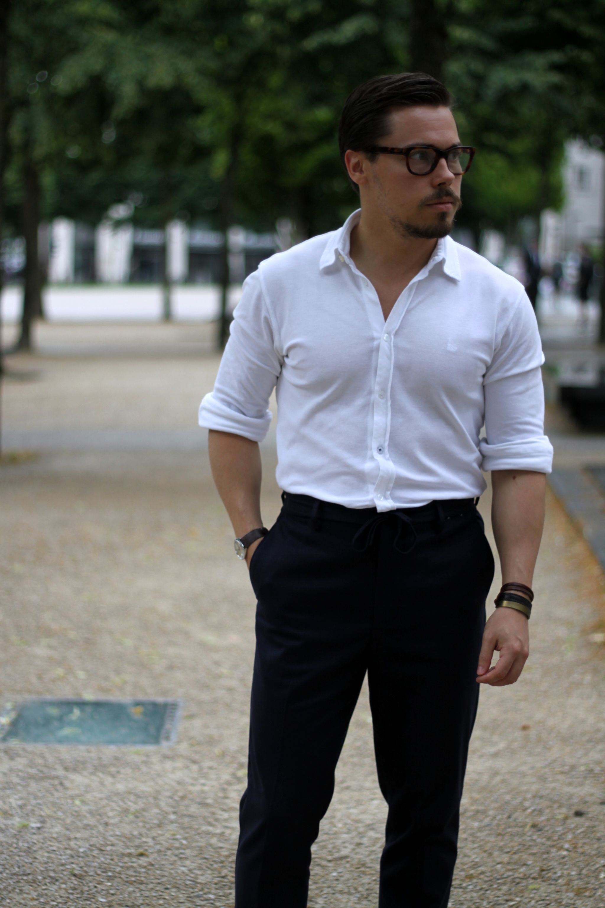 white pique shirt with dark blue cotton slacks