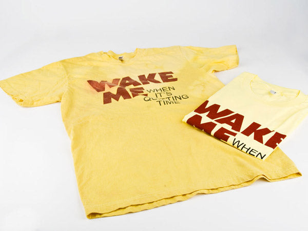 two yellow t-shirts, one has been aged and one is brand new