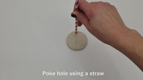 Poke hole into clay with a straw