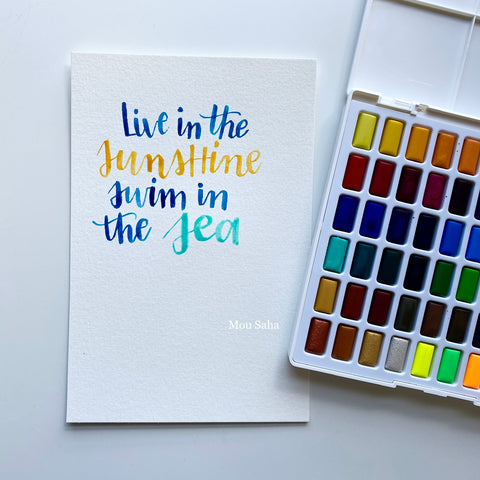 Watercolor lettering and a watercolor pan
