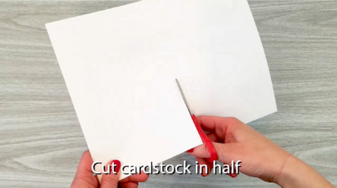 Cut card stock in half