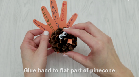 Glue Hand to Flat Part of Pinecone