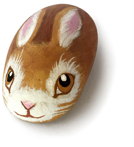 A rock with a bunny painted