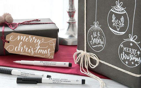 Calligraphy gift tag, Pitt Artist Pens, and wrapping paper