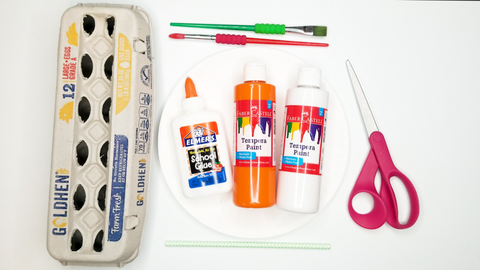 Egg carton craft supplies: egg carton, glue, scissors, tempera paint, and paint brushes