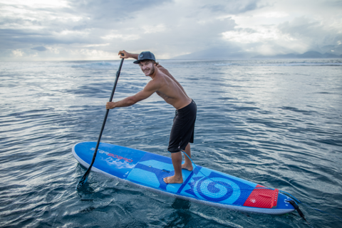 paddle boarding with a smile