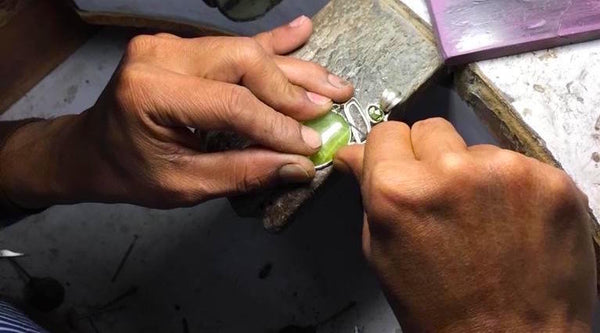 Expert Artisan setting stone individually by hand