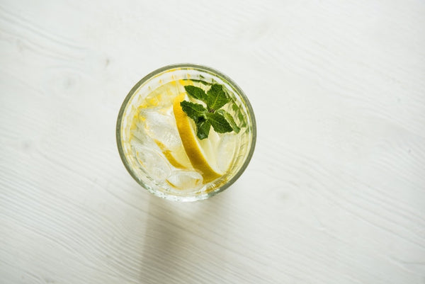 A glass of lemon and mint water