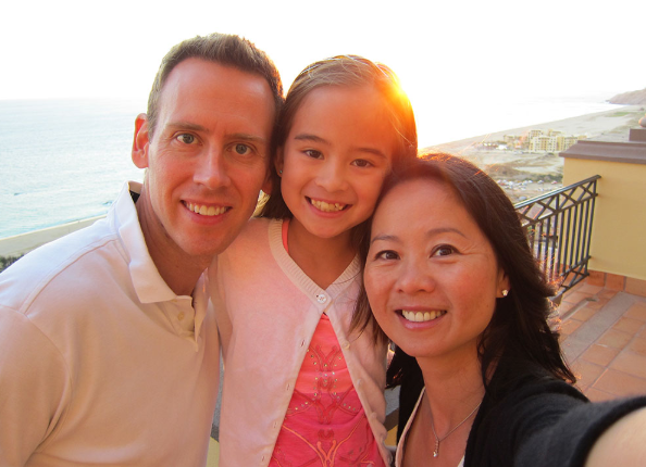 Dr. Wei, her husband Dave and her daughter Claire outside in Mexico
