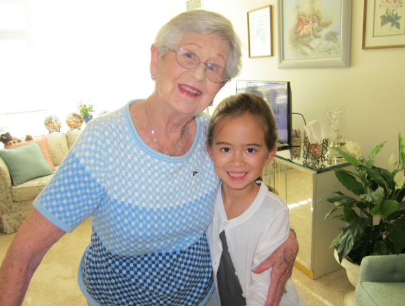 Grandma Tilly posing indoors with Dr. Wei's daughter, Claire