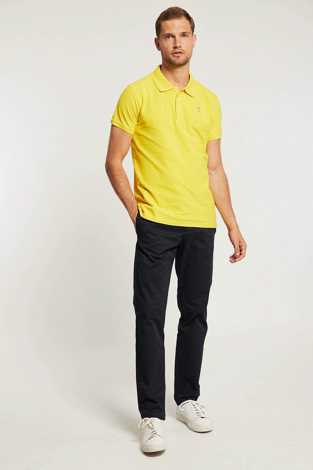 yellow polo shirt with white collar