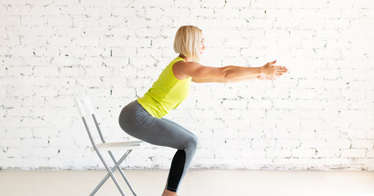 a lady is doing seated stretching 