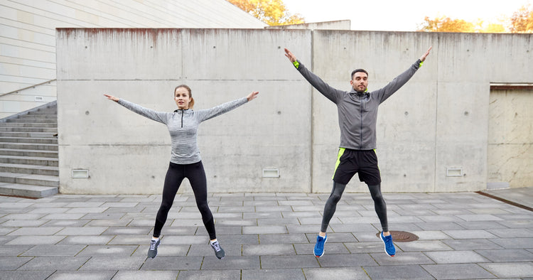 man and woman doing jumping jack