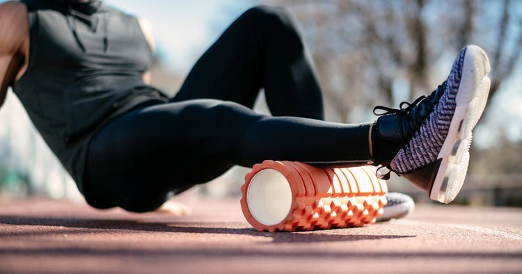 a man is foam rolling after workouts