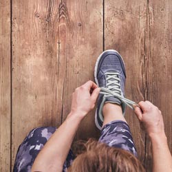 person tying shoes