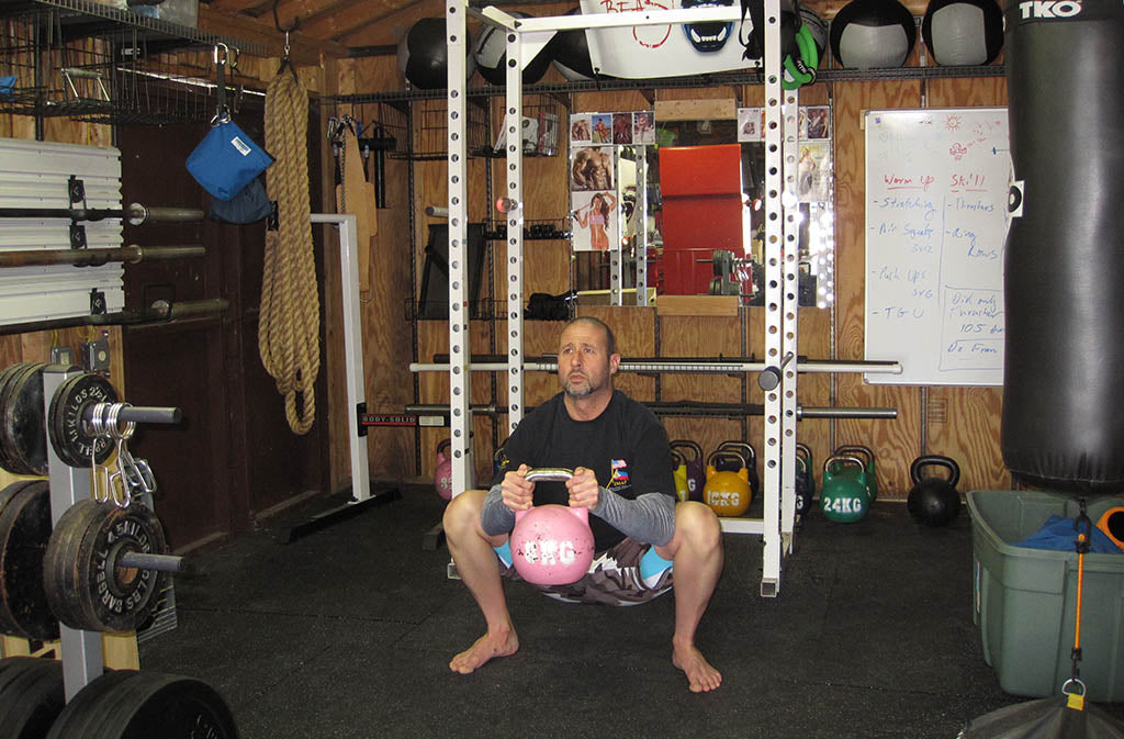 man in goblet squat