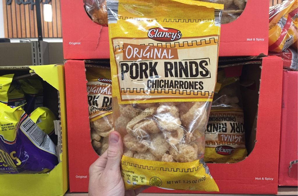hand holding a package of pork rinds