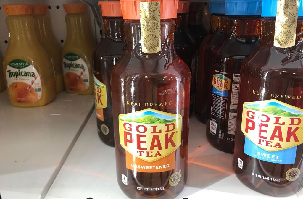 bottle of gold peak unsweetened tea in a refrigerator