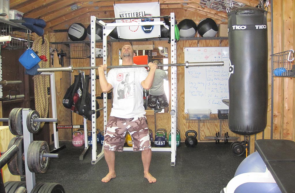 man doing push jerk