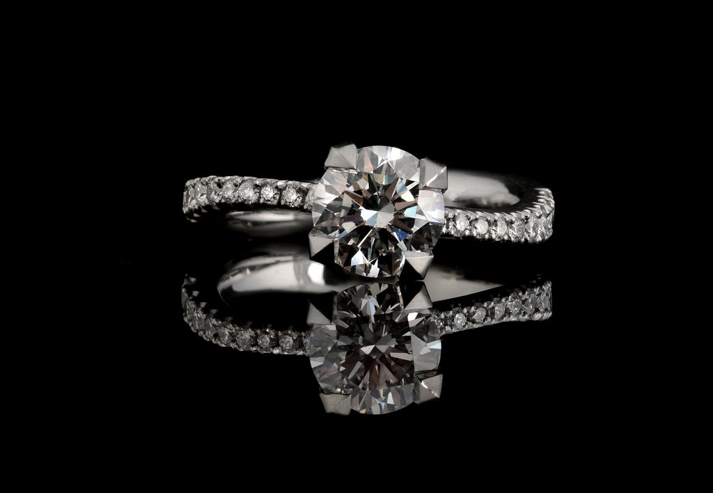 Final engagement ring with diamond set shoulders