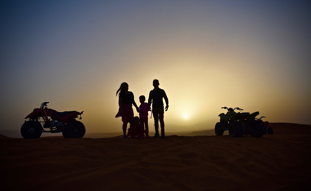 a-family-on-a-sunset-quad-bike-adventure