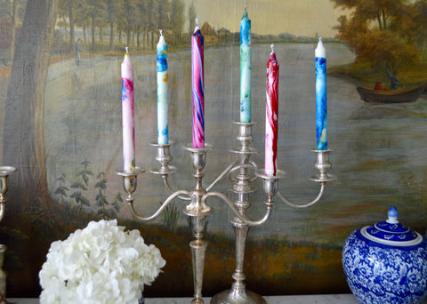 Colorful Marbelized candles in sterling silver candelabra 