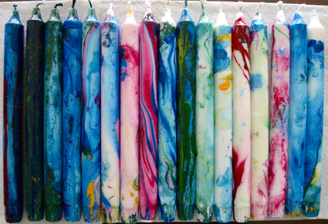 Colorful marbleized candles with enamel paint