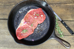 Searing a steak in a black cast iron skillet