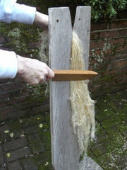 Scutching flax fibers