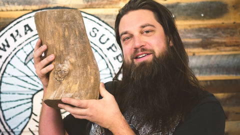 man holding a log with wild yeast